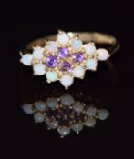 A 9ct gold ring set with amethyst and opals, 1.8g, size M