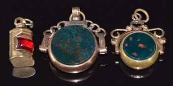 A 9ct rose gold swivel fob set with bloodstone and carnelain agate and a similar gold plated