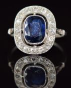 Art Deco Fontana platinum ring set with a cushion cut sapphire of approximately 1.4ct surrounded