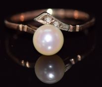 A 9ct gold ring set with a pearl and white sapphires, 1.9g, size L