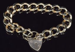 A 9ct gold curb link bracelet with heart padlock clasp, 47.6g, 20cm long