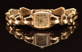 Tudor Royal 9ct gold ladies wristwatch with gold hands and Arabic numerals, silver dial and signed