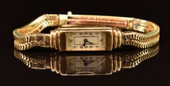 Unnamed 18ct gold ladies wristwatch with blued hands, black Arabic numerals and silver dial, on 18ct