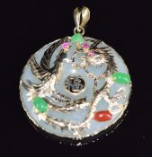 A jadeite pendant mounted with a 9ct gold dragon set with jadeite, rubies and coral, 3cm, 10g