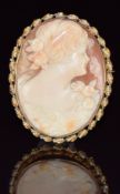 A 14k gold brooch set with a cameo with seed pearl rim, 11.4g, 4.5 x 3.5cm
