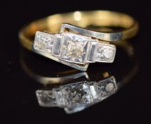 An 18ct gold ring set with three diamonds in a platinum setting, 2g, size J