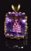 An 18ct gold pendant set with an emerald cut amethyst, 2.8 x 1.5cm, 9.5g