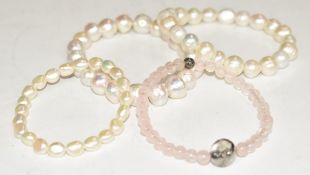 Three pearl bracelets and a rose quartz bracelet