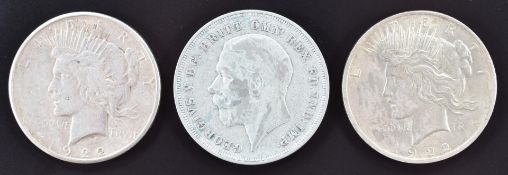 Two 1922 USA Liberty dollars and a George V 1935 'rocking horse' crown