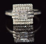 A 9ct white gold ring set with princess cut and round cut diamonds in a square setting, 2.8g, size