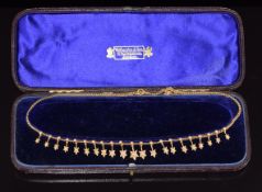 Edwardian 9ct gold necklace set with split and seed pearls in star settings, in vintage box, 16.