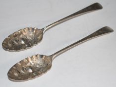 Pair of Georgian hallmarked silver berry spoons, London 1797 and 1789, both maker's marks rubbed,