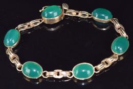A 9ct gold bracelet set with green agate cabochons, 16.1g, 18cm long