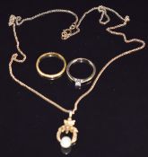 A 22ct gold wedding band/ ring (1.8g), 9ct gold ring set with a diamond (1.1g), and a 9ct gold