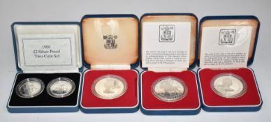 Royal Mint silver proof coins to include three Royal commemorative crowns and a pair of silver proof