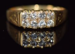 A 9ct gold ring set with eight diamonds, 4g, size L