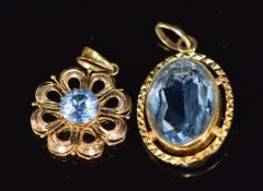 Two yellow metal pendants one set with topaz and the other paste, 6.1g