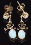 A pair of 9ct gold earrings set with opals, 2.3g, 2.4cm