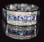 A 14ct white gold ring set with tanzanites and diamonds, 4.6g, size N