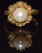 An 18ct gold ring set with a pearl, 3.7g, size O
