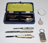 Cased hallmarked silver spoon and fork, bangle marked sterling silver, weight of three items 56g,