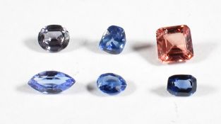 Three sapphires (0.26g), an emerald cut padparadscha sapphire (0.21g), a 0.62ct tanzanite and spinel
