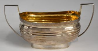 Georgian hallmarked silver twin handled sugar bowl with bright cut decoration and gilt interior,