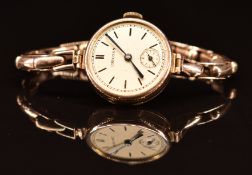 Unicorn 9ct gold ladies wristwatch with inset subsidiary seconds dial, blued hands and champagne