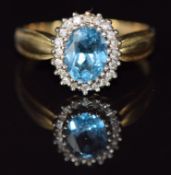 A 9ct gold ring set with blue topaz and diamonds, 3.7g, size Q