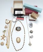A collection of jewellery including yellow metal Victorian brooch set with agate, Trifari brooch,