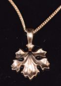 A 14ct rose gold leaf pendant on 14ct gold chain, pendant 2cm and chain 42cm, 3.2g