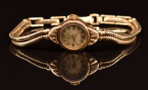 Avia 9ct gold ladies wristwatch with gold hands and hour markers and silver dial, on 9ct gold