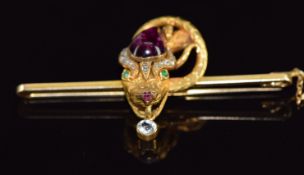 Victorian 9ct gold snake brooch set with a foiled pear shaped garnet cabochon, rose cut diamond,