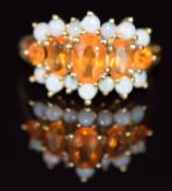 A 9ct gold ring set with paste and opals, 1.8g, size K