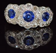 Art Deco 18ct gold ring set with three round cut sapphires surrounded by transitional cut diamonds