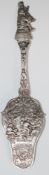 German silver serving slice with decoration of figures to the slice and handle, with 800 grade