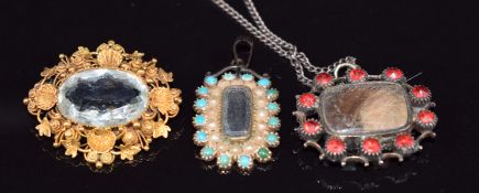 Two Victorian mourning lockets, one set with seed pearls and turquoise and one paste, and a