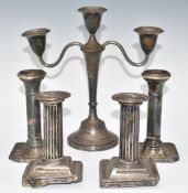 Two pairs of Victorian and later hallmarked silver candlesticks and a candelabra, comprising a