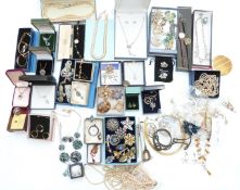 A collection of costume jewellery including Miracle brooch, Trifari brooch, silver ring set with