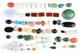A collection of loose jade, turquoise, coral, lavender jade, agate, etc