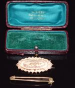 Edwardian 9ct gold brooch with floral and buckle decoration, in original box, and a 9ct gold pin set