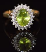 A 9ct gold ring set with peridot and cubic zirconia, 3.1g, size Q