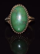 A 9ct gold ring set with a turquoise cabochon 5.3g, size N