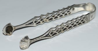 Pair of Georgian hallmarked silver sugar tongs, lion passant and maker's mark IB, length 13cm,