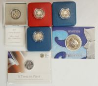 Four Royal Mint cased silver proof £1 coins, together with a 2003 silver Britannia and a 2013 fine