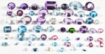 A collection of loose amethysts and topaz