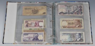 An album containing a collection of world banknotes