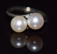 Mikimoto silver ring set with two pearls in a twist setting, in original box, size K