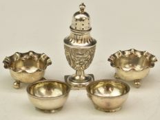 Two pairs of silver open salts, one Birmingham 1908, the other with Victorian coins to base,