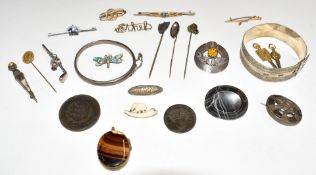 A silver bangle, Victorian banded agate brooch, silver bangle and baby brooch by Charles Horner,